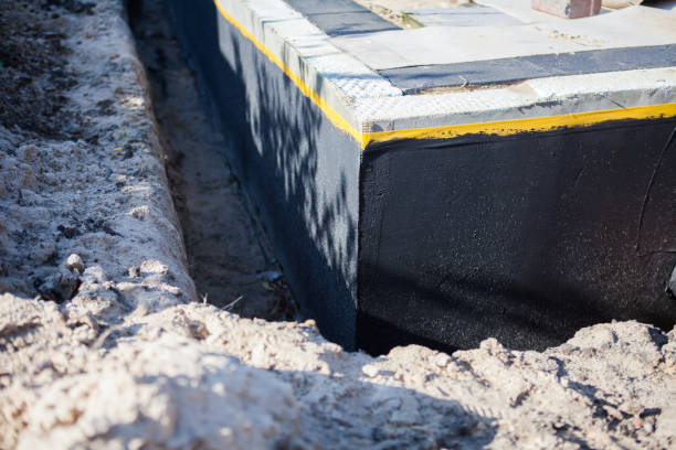 Professional Waterproofing technician working in Fulton, NY